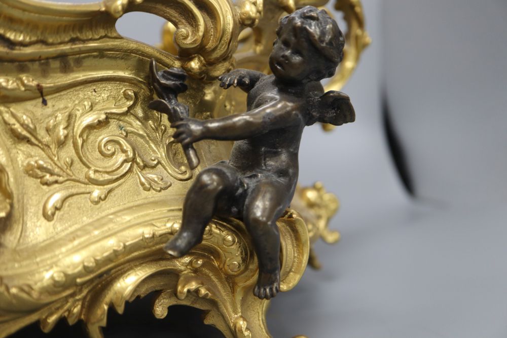 A Victorian style ormolu centrepiece, mounted with cherubs, length 43cm